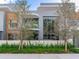 Modern two-story home with gray and wood siding, and a landscaped front yard at 3020 W Santiago St # 4, Tampa, FL 33629