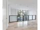Bright hallway with large window and modern glass railing at 3020 W Santiago St # 4, Tampa, FL 33629