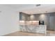 Modern kitchen with gray cabinets and marble countertops at 3020 W Santiago St # 4, Tampa, FL 33629