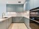 Modern kitchen with marble countertops and blue cabinets at 3020 W Santiago St # 4, Tampa, FL 33629