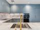 Modern kitchen with marble countertops and gold fixtures at 3020 W Santiago St # 4, Tampa, FL 33629