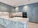 Modern kitchen with marble countertops and blue cabinets at 3020 W Santiago St # 4, Tampa, FL 33629