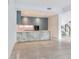 Modern kitchen with gray cabinets and marble countertops at 3020 W Santiago St # 4, Tampa, FL 33629