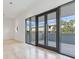 Bright living room with floor-to-ceiling windows and access to a balcony at 3020 W Santiago St # 4, Tampa, FL 33629
