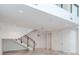 Open living room with staircase and marble floors at 3020 W Santiago St # 4, Tampa, FL 33629
