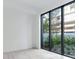 Bright living room with large windows and hardwood floors at 3020 W Santiago St # 4, Tampa, FL 33629