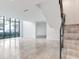 Bright living room with large windows and modern staircase at 3020 W Santiago St # 4, Tampa, FL 33629