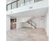 Open living room with staircase and marble floors at 3020 W Santiago St # 4, Tampa, FL 33629