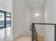 Modern staircase with metal railing and light wood steps at 3020 W Santiago St # 4, Tampa, FL 33629