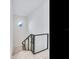 Modern staircase with metal railing and light-colored wood steps at 3020 W Santiago St # 4, Tampa, FL 33629