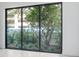 Sliding glass doors offer a view of a lush courtyard at 3020 W Santiago St # 4, Tampa, FL 33629