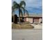 Single-story home with attached garage and palm tree at 409 Boca Ciega Point S Blvd # 1008, St Petersburg, FL 33708