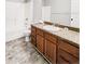 Clean bathroom with granite countertop, wood vanity, and shower/tub combo at 4721 Fairway N Dr, Punta Gorda, FL 33982