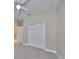 Spacious bedroom with neutral walls, carpeting, and a double door closet at 6910 Sail View Ln, Apollo Beach, FL 33572