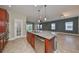 Kitchen island with granite countertop and stainless steel dishwasher at 6910 Sail View Ln, Apollo Beach, FL 33572