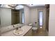 Bathroom featuring a tile shower, toilet, vanity, and tile floor at 87 Rotonda Cir, Rotonda West, FL 33947