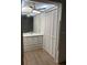 Bright bathroom features white cabinetry, a large mirror, and a linen closet at 87 Rotonda Cir, Rotonda West, FL 33947