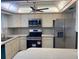 Bright kitchen with stainless steel appliances at 87 Rotonda Cir, Rotonda West, FL 33947