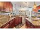 Kitchen with granite countertops, island, and stainless steel appliances at 10037 Oasis Palm Dr, Tampa, FL 33615