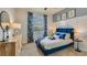 Relaxing bedroom with a comfortable bed, stylish decor, and ample natural light at 12067 Kingsley Trl, Parrish, FL 34219