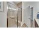 Walk-in shower with built-in seat and grab bar at 12316 Juniper Field Ct, Riverview, FL 33579