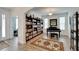 Elegant living area with hardwood floors and a grand piano at 12316 Juniper Field Ct, Riverview, FL 33579