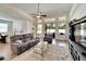Bright and airy living room featuring a cozy seating arrangement and large windows at 12316 Juniper Field Ct, Riverview, FL 33579