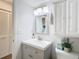 Stylish bathroom with vanity, mirror, and modern fixtures at 12914 Fairway Dr # A, Hudson, FL 34667