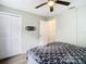 Cozy bedroom with ceiling fan, closet, and ensuite bathroom access at 12914 Fairway Dr # A, Hudson, FL 34667