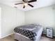 Inviting bedroom with ceiling fan, ample space, and simple decor at 12914 Fairway Dr # A, Hudson, FL 34667