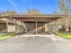 Covered carport with wooden beams and fencing at 12914 Fairway Dr # A, Hudson, FL 34667