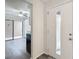 Bright entryway with view of kitchen and sliding glass door at 12914 Fairway Dr # A, Hudson, FL 34667