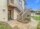 Exterior view of condo building showcasing stairs and entrance at 12914 Fairway Dr # A, Hudson, FL 34667