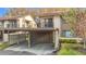 Exterior view of the condo with attached carport and balcony at 12914 Fairway Dr # A, Hudson, FL 34667