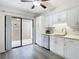 Eat-in kitchen with sliding door access to patio at 12914 Fairway Dr # A, Hudson, FL 34667