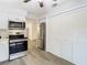 Updated kitchen with stainless steel appliances and white cabinets at 12914 Fairway Dr # A, Hudson, FL 34667