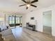 Living room with gray sofa and sliding glass doors to patio at 12914 Fairway Dr # A, Hudson, FL 34667