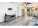 Open living space with gray sofa and view to dining area at 12914 Fairway Dr # A, Hudson, FL 34667