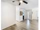 View of living room from entryway, showcasing laminate floors at 12914 Fairway Dr # A, Hudson, FL 34667