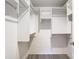 Spacious walk-in closet with built-in shelving and ample hanging space at 12914 Fairway Dr # A, Hudson, FL 34667