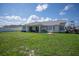 Spacious backyard with a covered patio, perfect for outdoor entertaining at 13346 Carter Ave, Port Charlotte, FL 33981