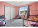 Cheerful pink bedroom ideal for a room at 13346 Carter Ave, Port Charlotte, FL 33981