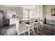 Stylish kitchen with white cabinets, sleek countertops, and bar seating at 13346 Carter Ave, Port Charlotte, FL 33981