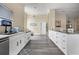 Modern kitchen featuring white cabinets, stainless steel appliances, and an island at 13346 Carter Ave, Port Charlotte, FL 33981