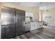 Updated kitchen with stainless steel appliances, white cabinetry, and ample counter space at 13346 Carter Ave, Port Charlotte, FL 33981