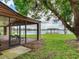 Peaceful backyard with screened porch and lake access at 18120 Wayne Rd, Odessa, FL 33556