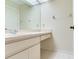 Bathroom vanity with mirror and white cabinets at 18120 Wayne Rd, Odessa, FL 33556