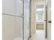 Bathroom shower with glass door and tile surround at 18120 Wayne Rd, Odessa, FL 33556