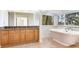 Bathroom with a freestanding tub and granite countertop at 18120 Wayne Rd, Odessa, FL 33556