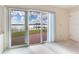 Bedroom with sliding doors leading to a lake view at 18120 Wayne Rd, Odessa, FL 33556